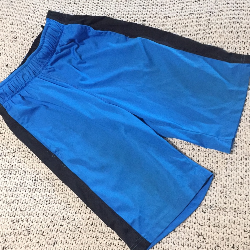 Boys Nike blue/black shorts, size small.